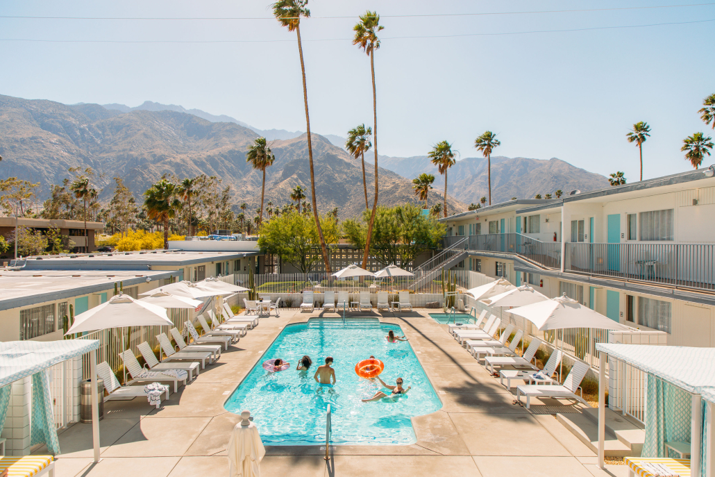 Revelers celebrate in the sparkling blue pool at the Skylark Palm Springs hotel