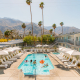 Revelers celebrate in the sparkling blue pool at the Skylark Palm Springs hotel