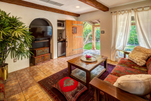 The Fountain Room at Talavera Palm Springs has a spacious living room with antique furnishings