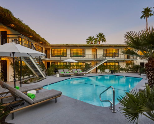 The gorgeous pool at Descanso Resort in Palm Springs is surrounded by the men's clothing-optional hotel's comfortable guest rooms