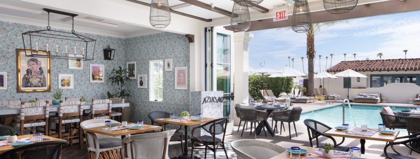 Tables and chairs in the brightly colored dining room at Azucar Restaurant at La Serena Villas