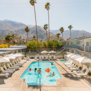 People play in the courtyard pool at Skylark Hotel in Palm Springs on a sunny day