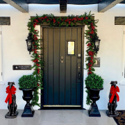 Garland and red bows are put up around the entrance of Amin Casa boutique hotel in Palm Springs, California