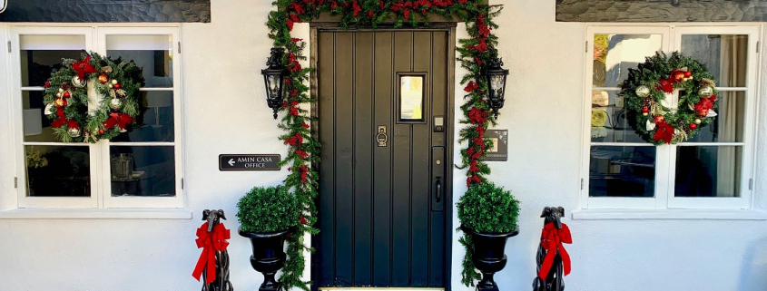 Garland and red bows are put up around the entrance of Amin Casa boutique hotel in Palm Springs, California