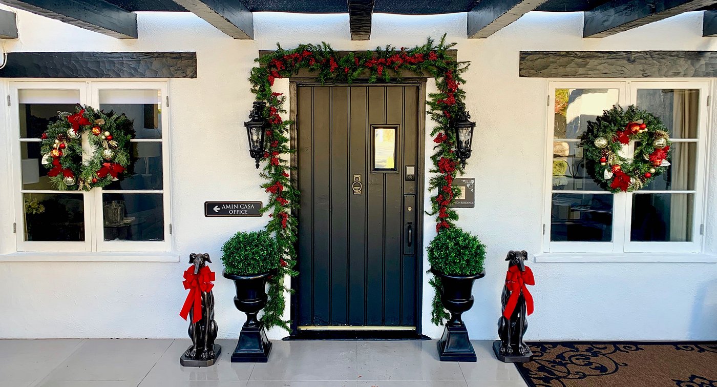 Garland and red bows are put up around the entrance of Amin Casa boutique hotel in Palm Springs, California