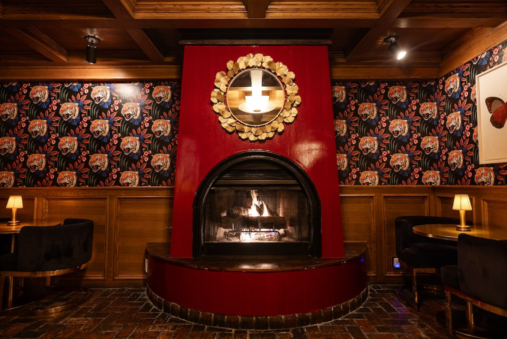 The dark red fireplace and tile in the Del Rey restaurant