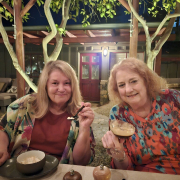 Two women with blonde hair enjoy dessert at Sparrows Lodge