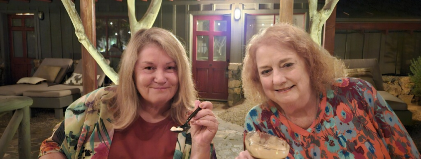 Two women with blonde hair enjoy dessert at Sparrows Lodge