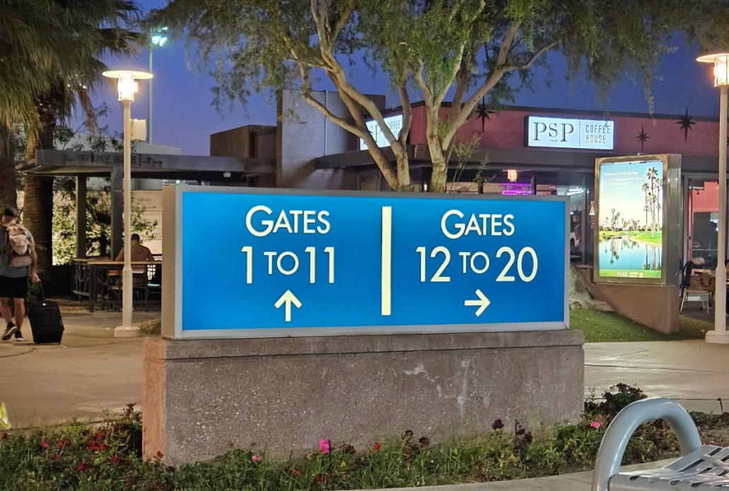 Gate signs at dusk at Palm Springs International Airport