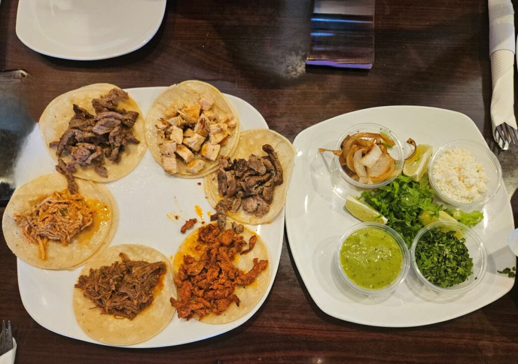 A plate of tacos and a plate of salsas at Maracas Cantina in Palm Springs