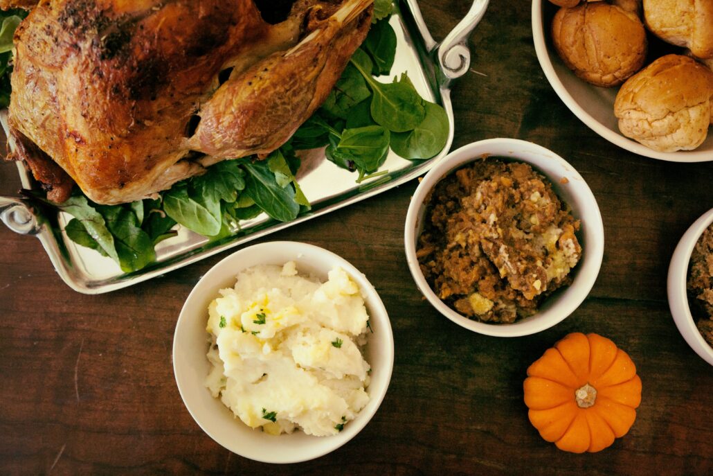 A table with turkey and Thanksgiving sides