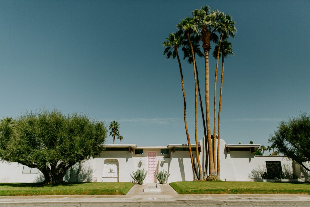 A pink door at a mid-century modern home in Palm Springs