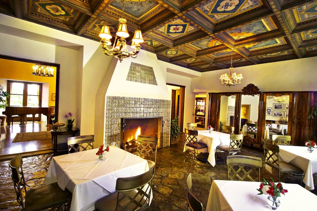The elaborate painted ceiling in the dining room at The Willows Historic Palm Springs Inn