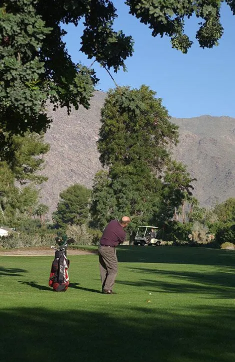 A man hits a golf ball at the course at Smoke Tree Ranch in Palm Springs, California