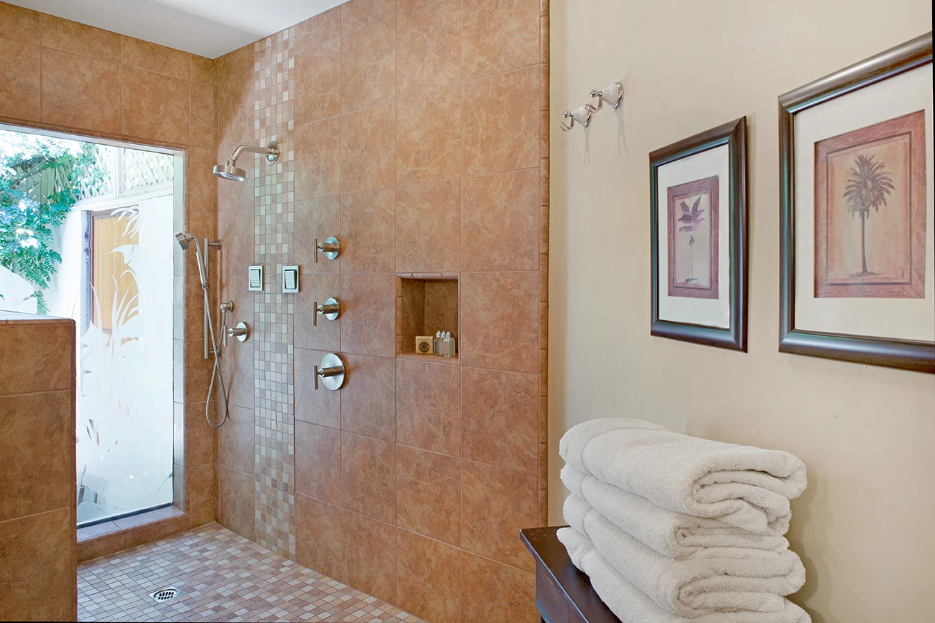 A large tiled shower is just one of the luxurious amenities at the Hacienda at Warm Sands, a men's clothing-optional resort in Palm Springs, California