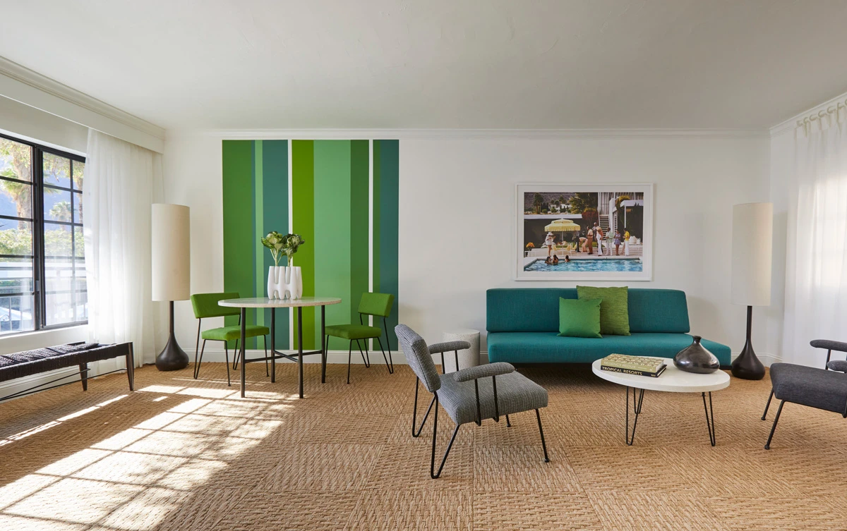 A green accent wall makes a bold statement in this room at the Descanso Resort in Palm Springs, California