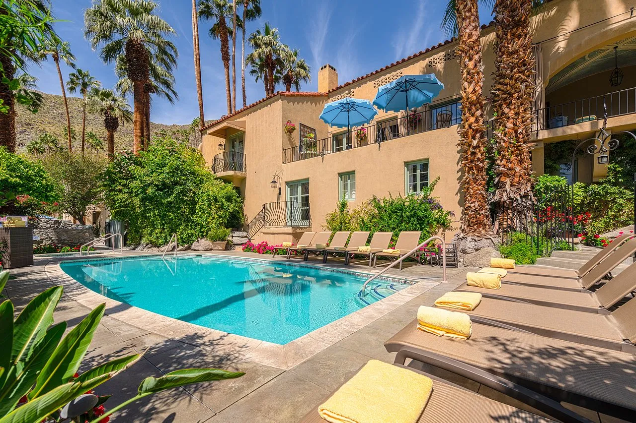 The pool at the Willows Historic Palm Springs Inn as viewed from behind the hotel