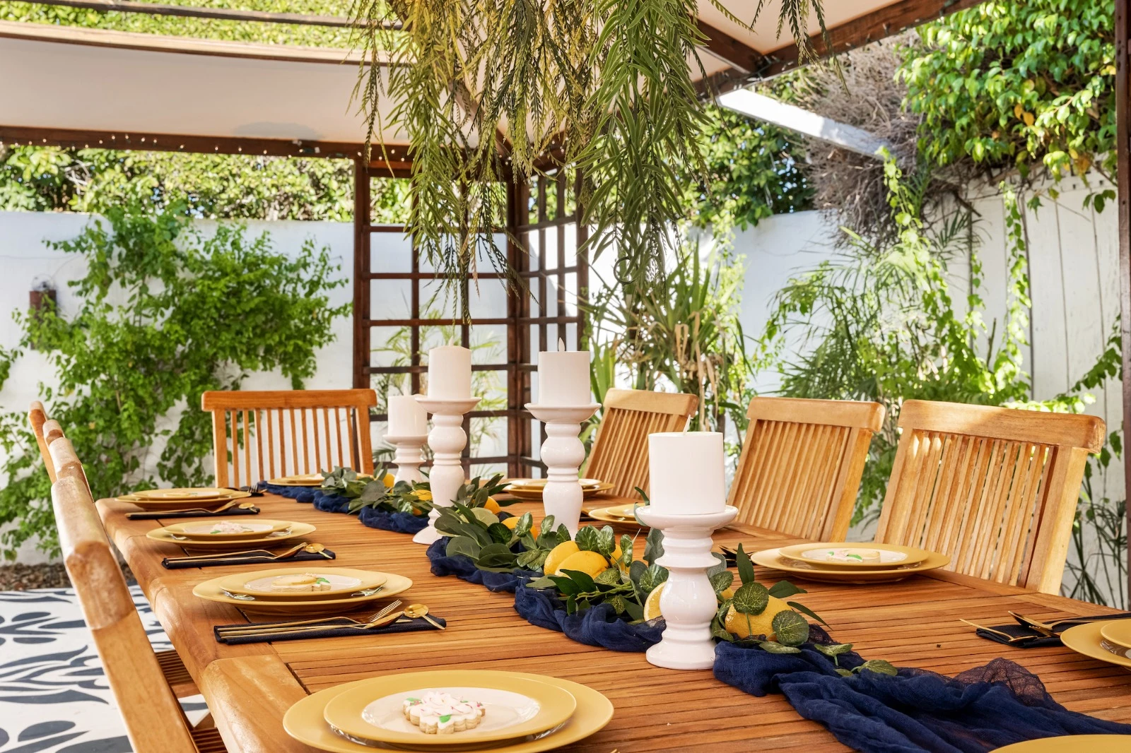 Outdoor seating under a tree at the Spirit of Sofia boutique hotel in Palm Springs, California