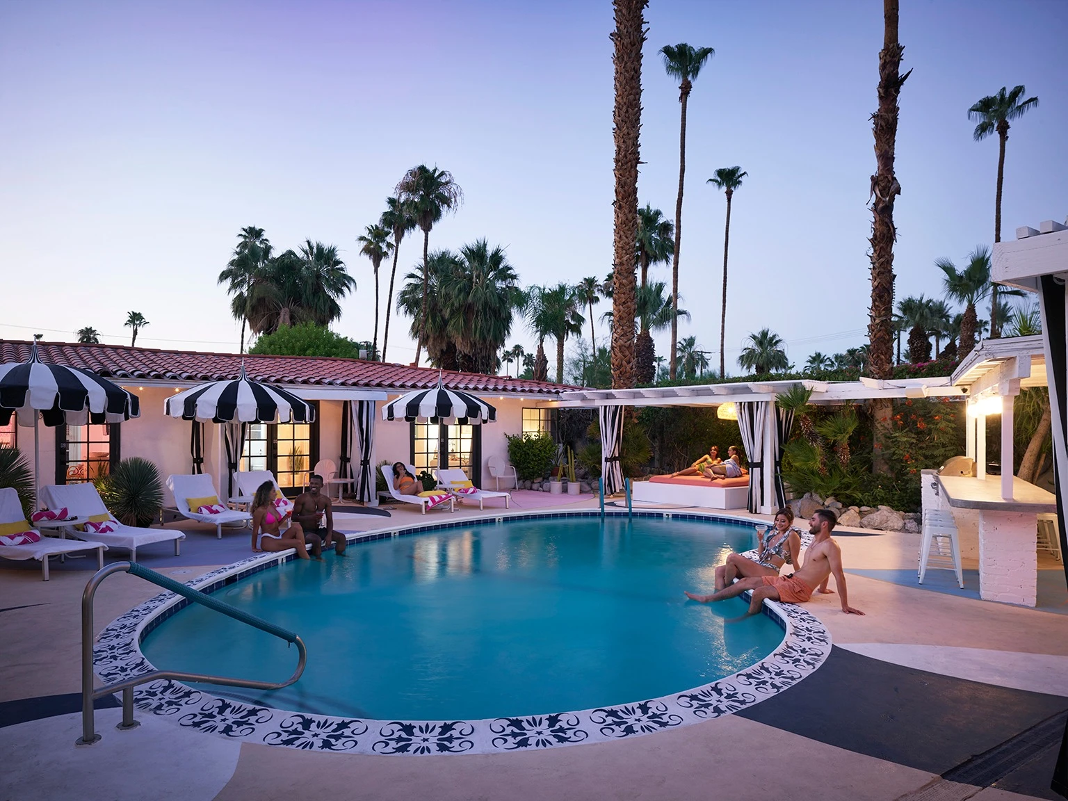 The pool at Spirit of Sofia in Palm Springs, California, during the evening