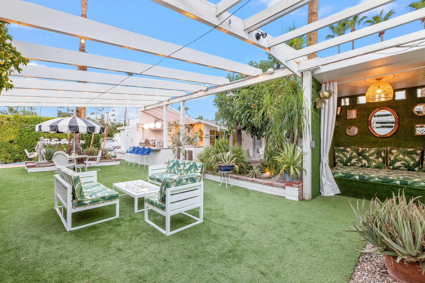 The outdoor dining space with a large table at the Spirit of Sofia hotel in Palm Springs, California