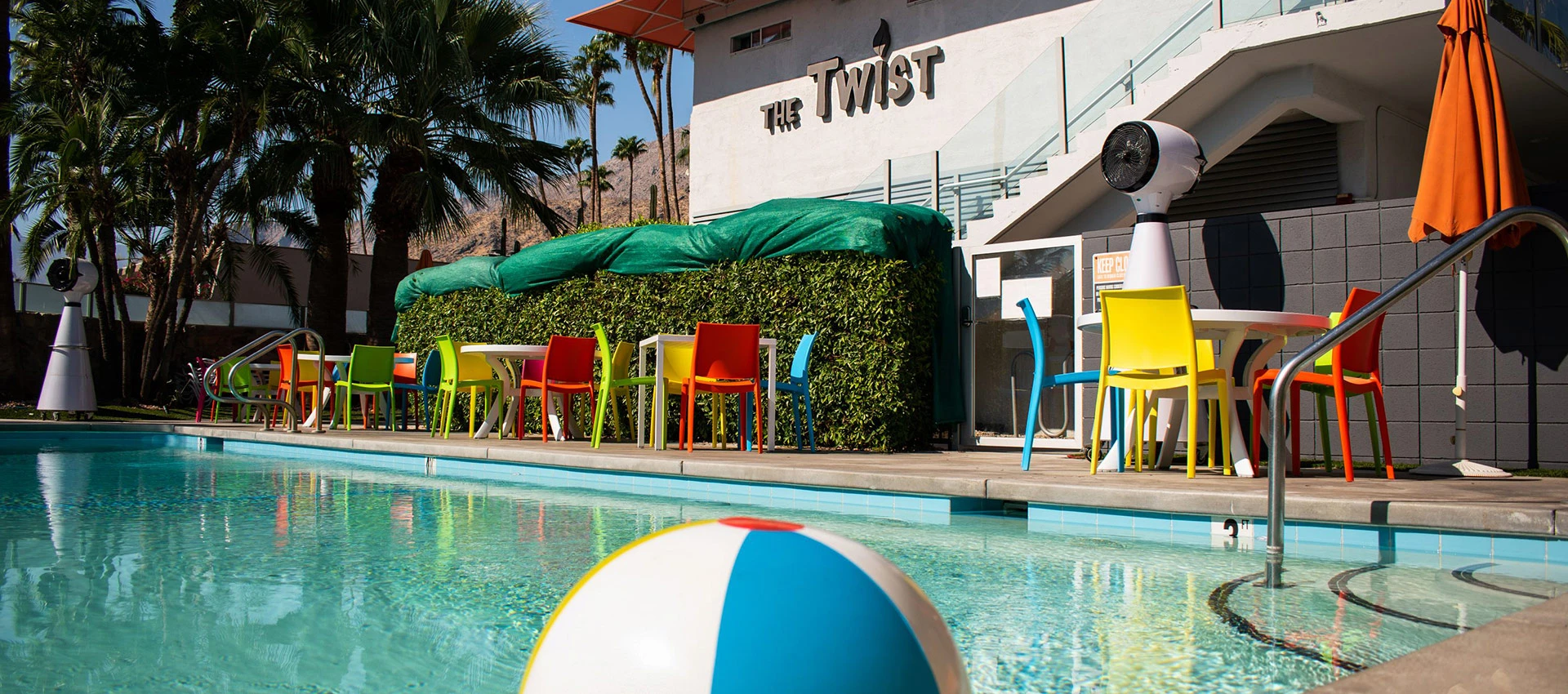 A beach ball floats in the pool at The Twist Palm Springs hotel in Palm Springs, California