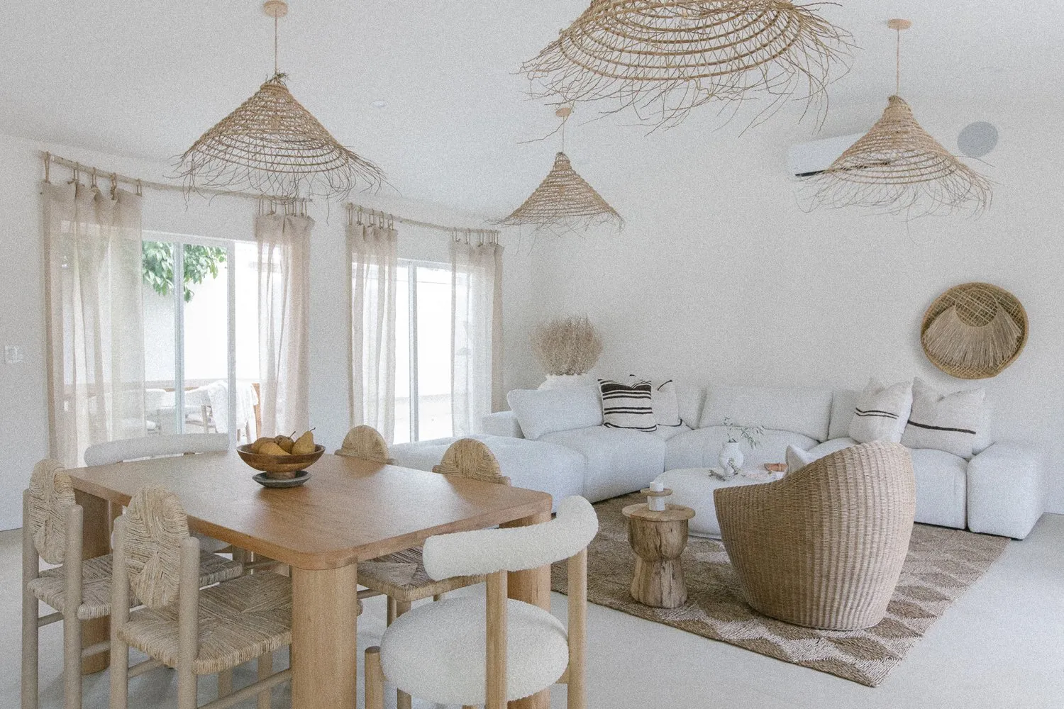 Inside a serene room with wicker furniture at Yara Hotel in Palm Springs, California