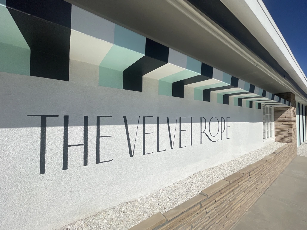 The striped front wall of The Velvet Rope hotel in Palm Springs, California