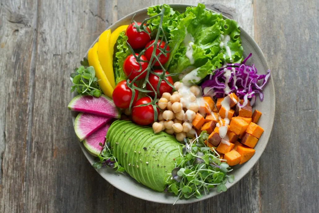 A colorful salad in a white bowl