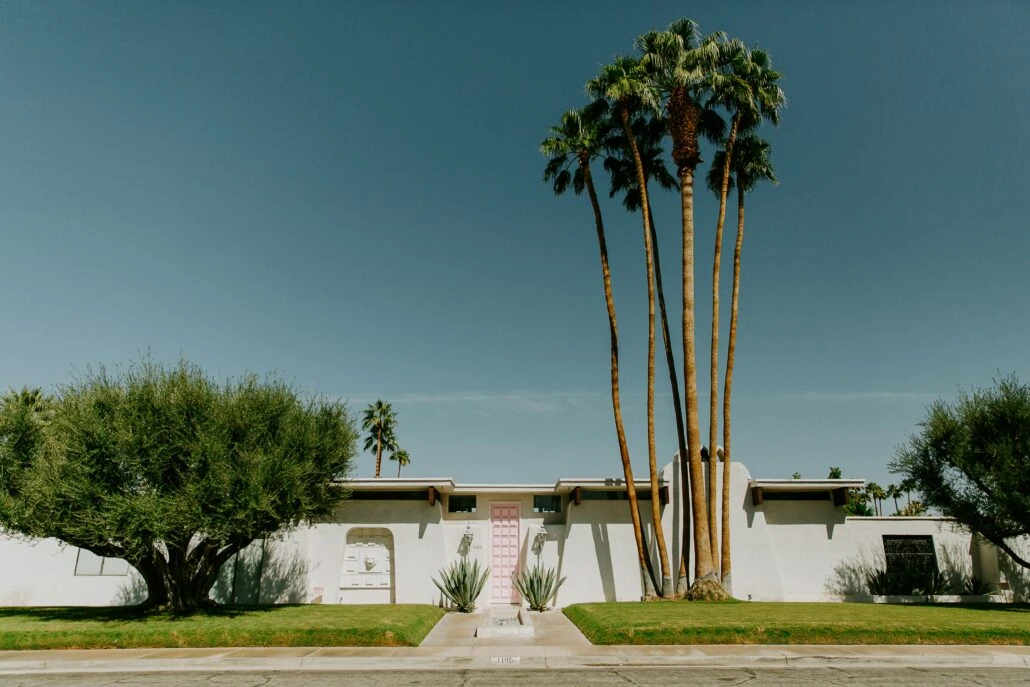 A pink door at a mid-century modern home in Palm Springs