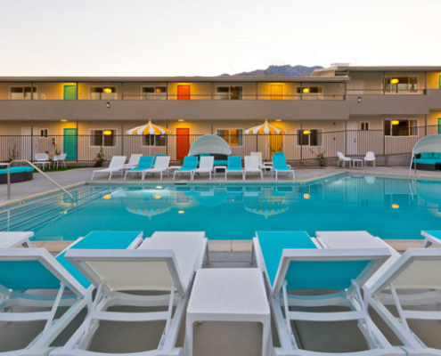 The large pool at The Cole Hotel at sunset in Palm Springs, California